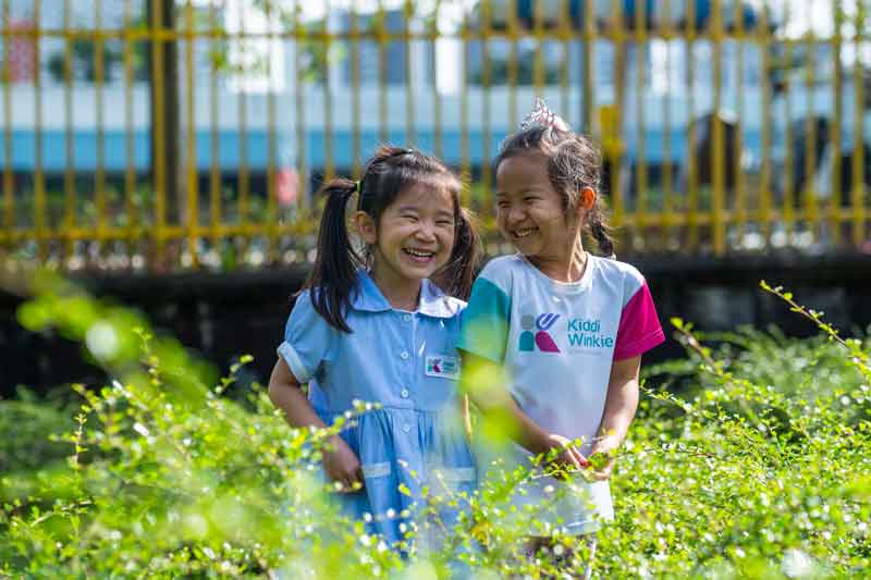 Children enjoying outdoor play at KiddiWinkie nursery