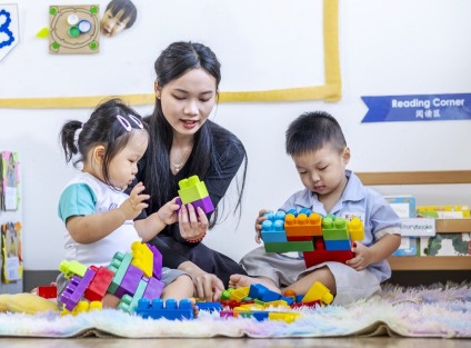 preschool teacher guiding children