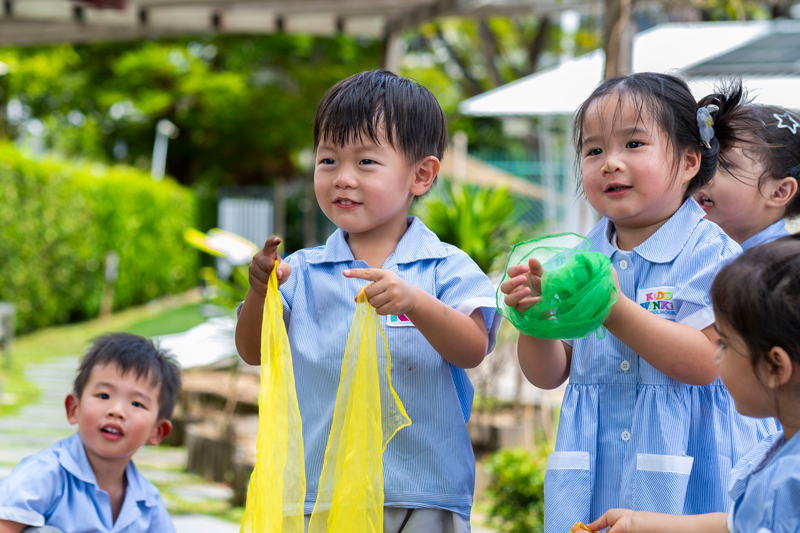 Children enjoying outdoor play at KiddiWinkie nursery